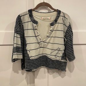 Distressed designer short sleeve shirt.